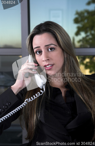 Image of sitting at her desk