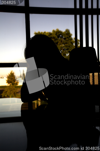 Image of depressed at her desk