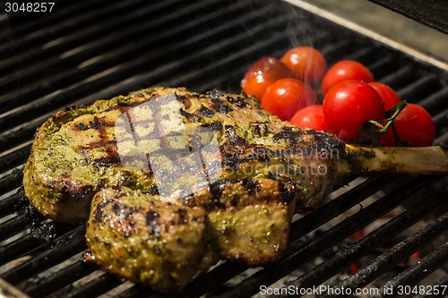 Image of steak flame broiled on a barbecue