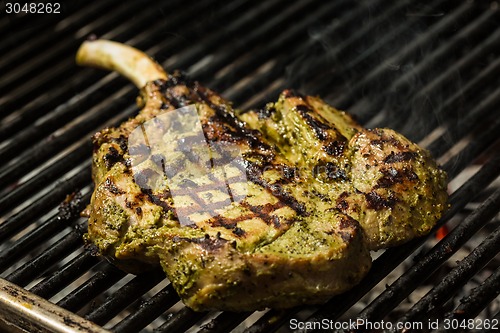 Image of steak flame broiled on a barbecue