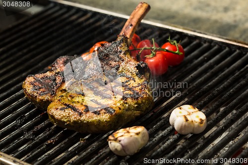 Image of steak flame broiled on a barbecue