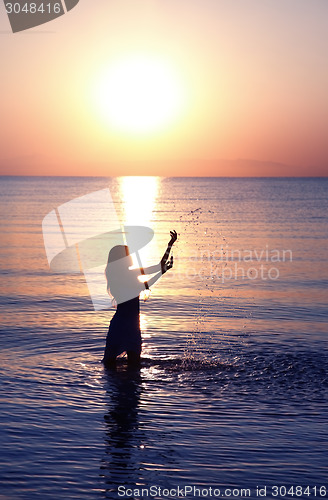 Image of Woman at sunset