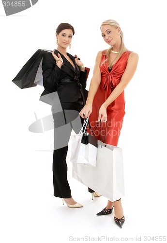 Image of two happy girls with shopping bags