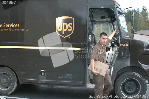 Image of Ups truck and driver.