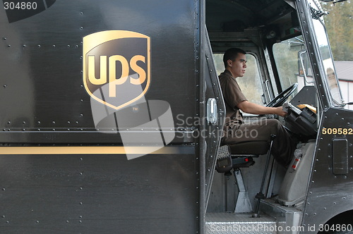 Image of Ups truck and driver.