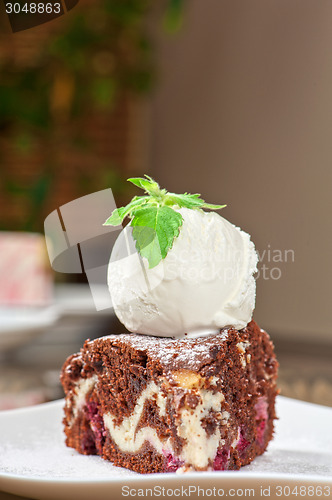 Image of chocolate cake with jam ice cream