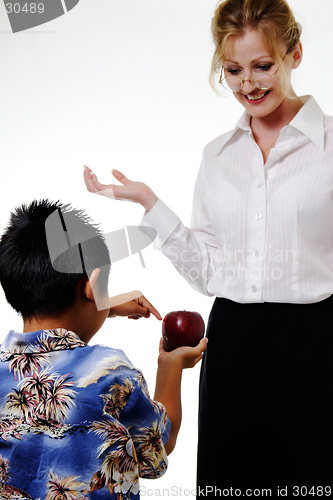 Image of Boy showing teacher apple