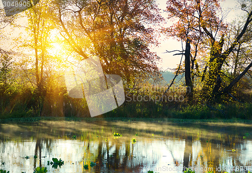 Image of Bright sunrise over river