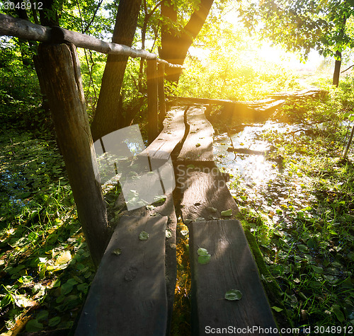 Image of Sun over little bridge