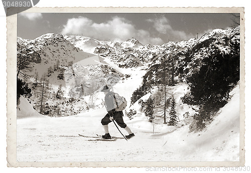 Image of Skier with vintage skis