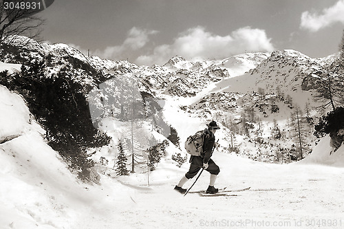 Image of Skier with vintage skis