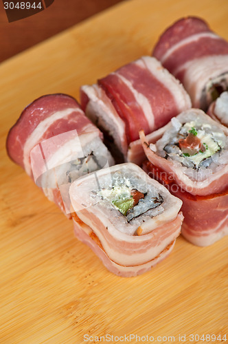 Image of Sushi roll with bacon