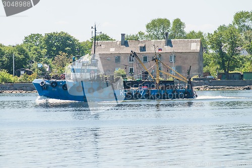 Image of Fishing ship goes via Baltic sea channel to base