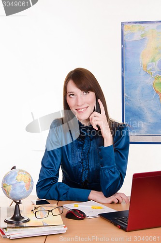 Image of Travel agency manager talking on the phone