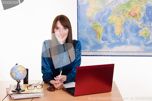 Image of Shy girl in office of the travel agency