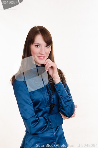 Image of Portrait of a young beautiful girl in blue blouse