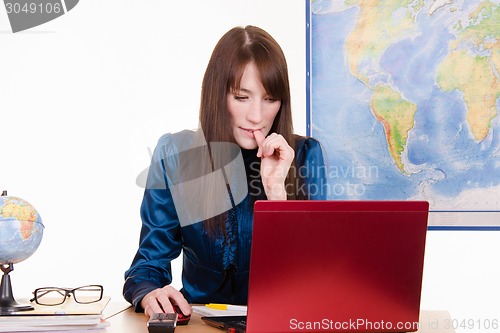 Image of Concerned woman - an employee of a travel agency