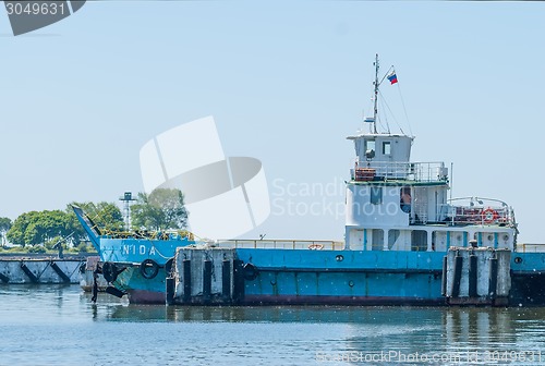 Image of Nida ferry boat on spit for cars and people