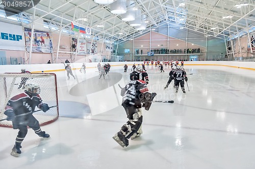 Image of Warm-up before game of children ice-hockey teams