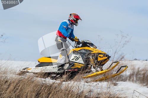 Image of Snowmobile rider on sport track