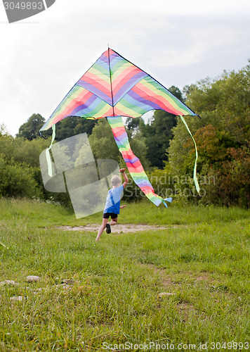 Image of Boy play with kite