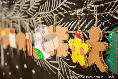 Image of Cardboard toys for the Christmas tree or garland. Creative decorations. Selective Focus