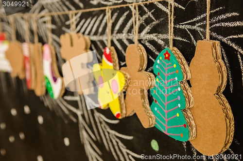 Image of Cardboard toys for the Christmas tree or garland. Creative decorations. Selective Focus