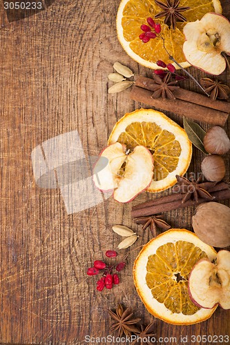 Image of Christmas spices and dried orange sliceson 