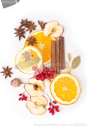 Image of Christmas spices and dried orange sliceson 