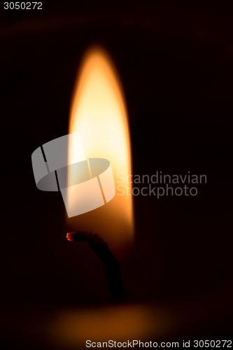 Image of closeup macro of light on candle 