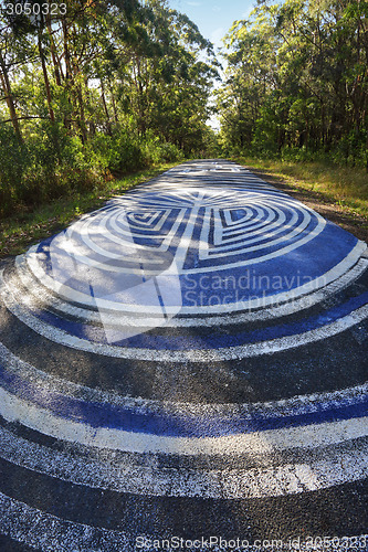 Image of Peace signs on the road demonstrate a peaceful resistance to com