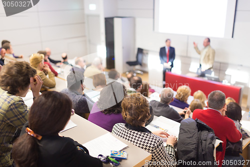 Image of Speaker at Business Conference and Presentation.