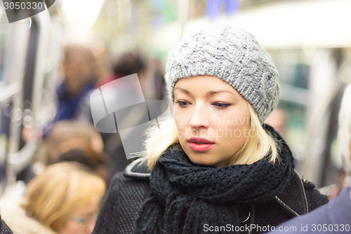 Image of Woman on subway.