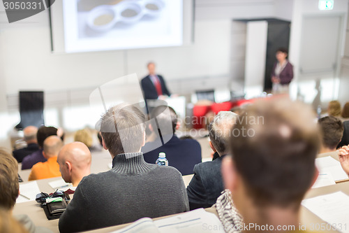 Image of Speaker at Business Conference and Presentation.