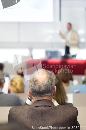 Image of Speaker at Business Conference and Presentation.