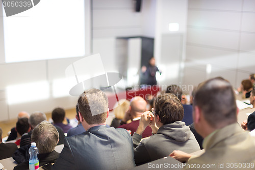 Image of Speaker at Business Conference and Presentation.