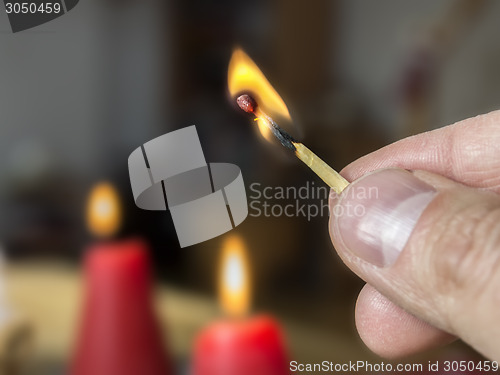 Image of burning match