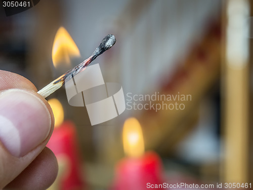 Image of burning match