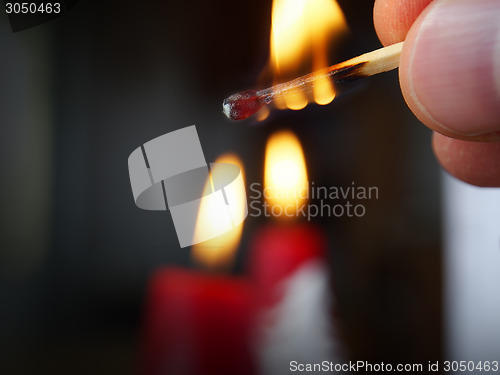 Image of burning match