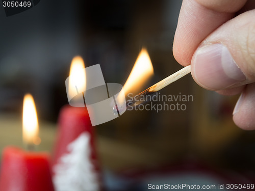 Image of burning match