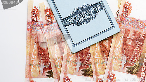 Image of Bank deposit book and money
