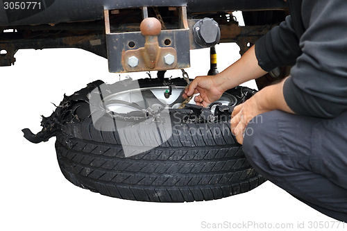 Image of changing exploded truck wheel