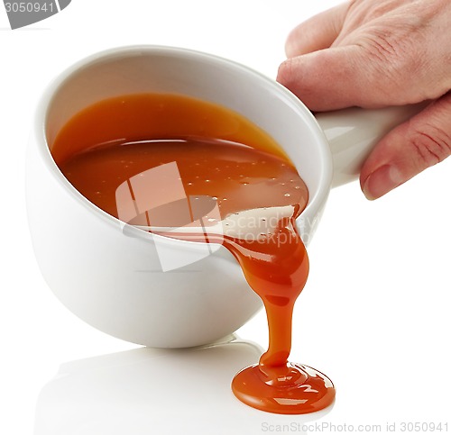 Image of bowl of melted caramel sauce