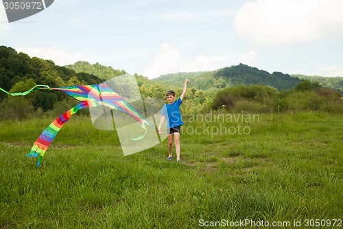 Image of Boy play with kite