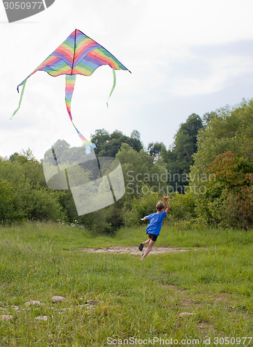 Image of Boy play with kite