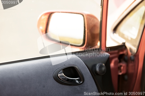 Image of Car door interior with rearview mirror