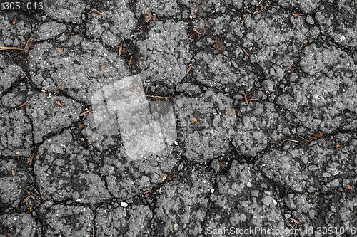 Image of Tarmac road with big holes in Belgium