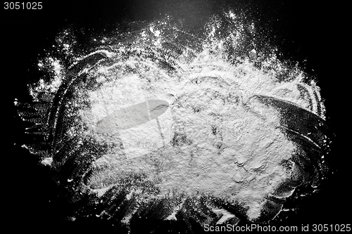 Image of White flour on black background