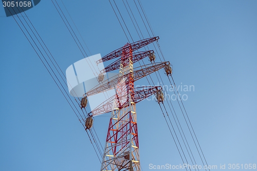 Image of Large transmission towers at sunset