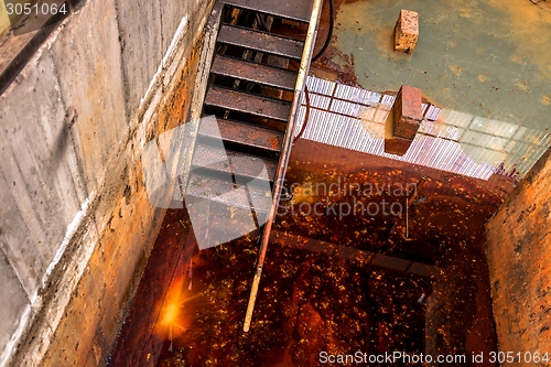 Image of Polluted water in tank